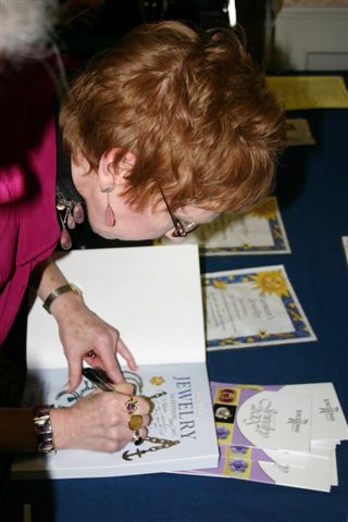 Christie signing her books for members.