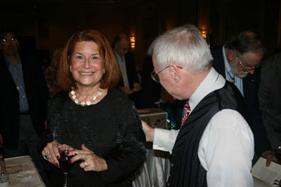 Audrey Hagedorn and Bobby Mann try to out bid each other at the silent auction table.