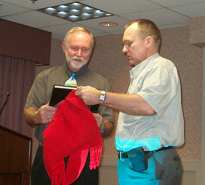 Dr. Snee receiving our Smithsonian Gems gift book from Pres. Toby Fitzkee