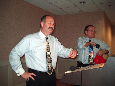 Speaker Bill Boyajian reads out the winning raffle ticket number.
